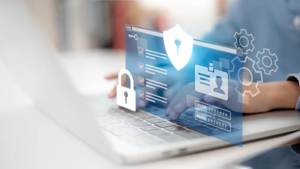 Un propriétaire d’entreprise travaillant sur son ordinateur portable sur lequel des éléments graphiques sont superposés pour montrer le mot de passe et la protection de sécurité.